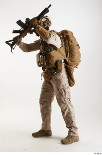 Casey Schneider in Desert Marpat Fighting fighting standing whole body…